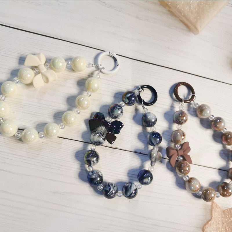 Wholesale Electroplated beaded bow car key chain mobile phone pendant cute candy color paint ring pearl accessories bag